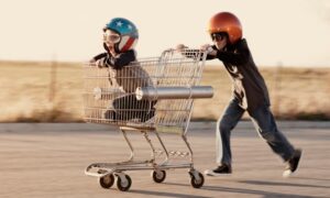 Kids speeding with shopping cart