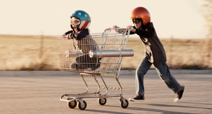 Kids speeding with shopping cart