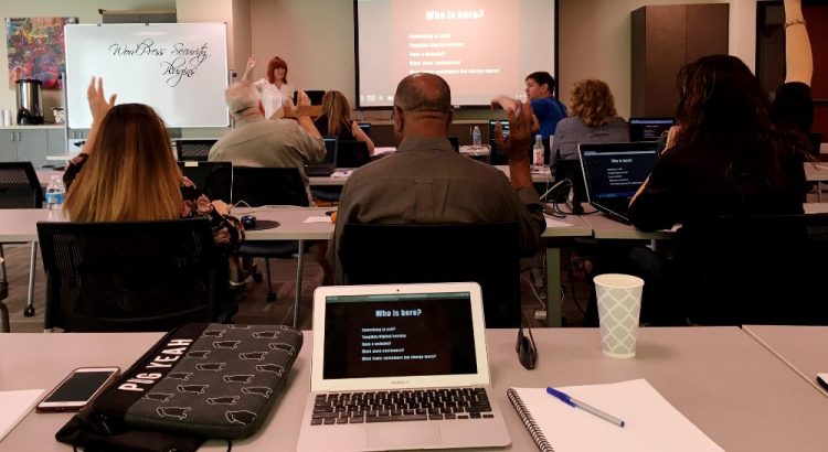 Emily Journey teaching at front of classroom