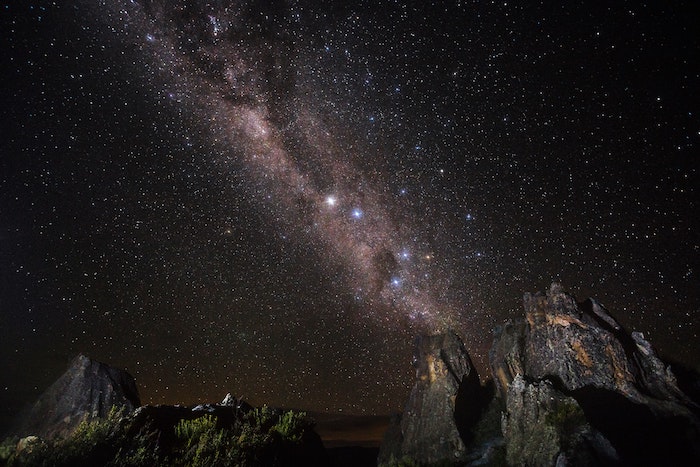 star filled sky above mountains