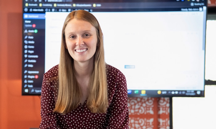 woman in front of presentation screen