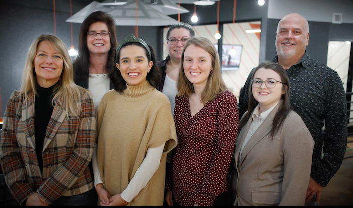 team of employees smiling